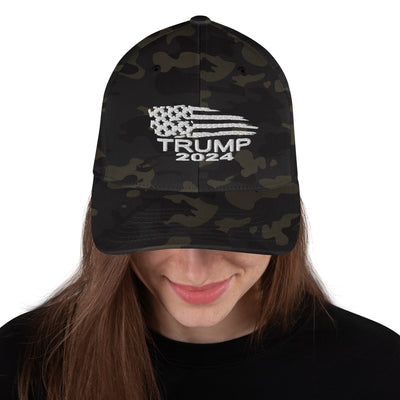 Structured Twill Cap Trump Flag White WritingAvailable in two sizes with an elastic stretch band, this hat is a sure winner in comfort! It has an athletic shape with a curved visor. 

• 63% polyester, 34% cotStructured Twill Cap Trump Flag White Writing