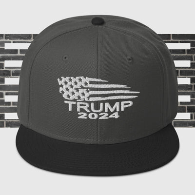 Snapback Hat Trump Flag White WritingThis is the snapback of your dreams! It's structured and high-profile, with a flat visor and a subtle grey under visor. 

• 85% acrylic, 15% wool
• Structured, 6-Snapback Hat Trump Flag White Writing